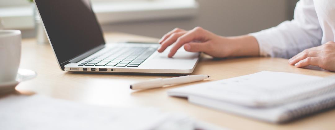 woman typing on laptop